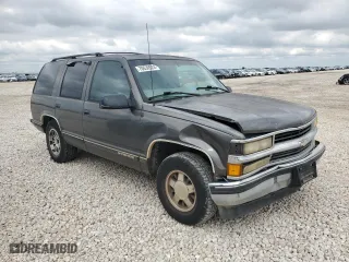 1999 Chevrolet Tahoe with VIN 1GNEC13R6XR150124, listed as a Copart auction lot 70630524 with 238,990 mi miles and Salvage Title. Bid and sale history available at carsss.com. Image 4.