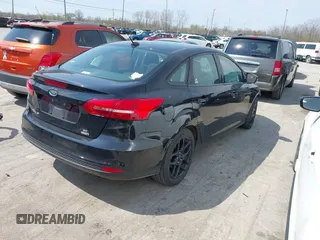 2016 Ford Focus SE with VIN 1FADP3FE6GL335943, listed as a IAAI auction lot 42060995 with 115,701 mi miles. Bid and sale history available at carsss.com. Image 4.