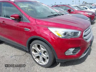 2019 Ford Escape Titanium z VIN 1FMCU0J96KUB79330, wystawiony jako IAAI lot #42018346 z przebiegiem 35 500 mil mil oraz . Historia ofert i sprzedaży dostępna na DreamBid. Obrazek 1.