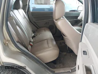 2005 Jeep Grand Cherokee Laredo with VIN 1J4GR48KX5C589625, listed as a IAAI auction lot 42699102 with Not provided miles and . Bid and sale history available at DreamBid. Image 8.