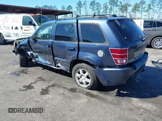 2009 Jeep Grand Cherokee Laredo with VIN 1J8HR48P19C540785, listed as a IAAI auction lot 41729851 with 205,504 mi miles. Bid and sale history available at carsss.com. Image 3.