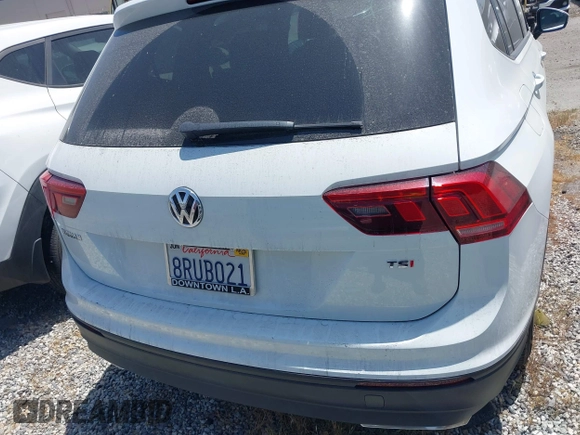 2018 Volkswagen Tiguan S with VIN 3VV1B7AX8JM032990, listed as a IAAI auction lot 42279807 with 74,185 mi miles and . Bid and sale history available at DreamBid. Image 17.