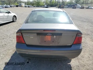 2007 Ford Focus S z VIN 1FAHP34N57W145697, wystawiony jako Copart lot #55335235 z przebiegiem 228 416 mil mil oraz Nie do naprawy • Non repairable. Historia ofert i sprzedaży dostępna na DreamBid. Obrazek 6.