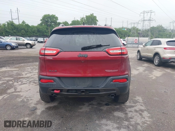 2015 Jeep Cherokee Trailhawk with VIN 1C4PJMBSXFW667469, listed as a IAAI auction lot 42438006 with 127,136 mi miles and . Bid and sale history available at DreamBid. Image 17.