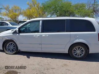 2014 Dodge Grand Caravan SXT with VIN 2C4RDGCG1ER429495, listed as a IAAI auction lot 42058513 with 136,936 mi miles and . Bid and sale history available at DreamBid. Image 14.