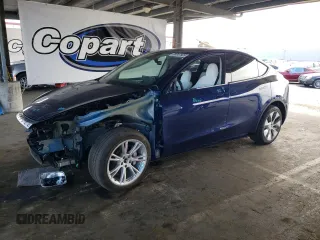 2023 Tesla Model Y Long Range z VIN 7SAYGDEE2PF841276, wystawiony jako Copart lot #59347805 z przebiegiem 11 040 mil mil oraz Szkoda całkowita • Salvage title. Historia ofert i sprzedaży dostępna na DreamBid. Obrazek 1.