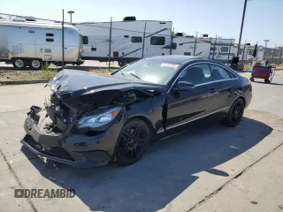 2014 Mercedes-Benz E 350 with VIN WDDKJ5KB2EF268494, listed as a Copart auction lot 60667295 with 84,675 mi miles and Salvage title. Bid and sale history available at DreamBid. Image 1.