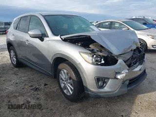 2015 Mazda CX-5 Touring with VIN JM3KE2CYXF0435583, listed as a IAAI auction lot 41737810 with 107,270 mi miles and . Bid and sale history available at carsss.com. Image 1.