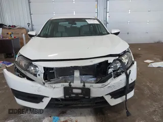 2017 Honda Civic LX with VIN 19XFC2F5XHE007668, listed as a IAAI auction lot 42219927 with 132,444 mi miles and . Bid and sale history available at DreamBid. Image 12.