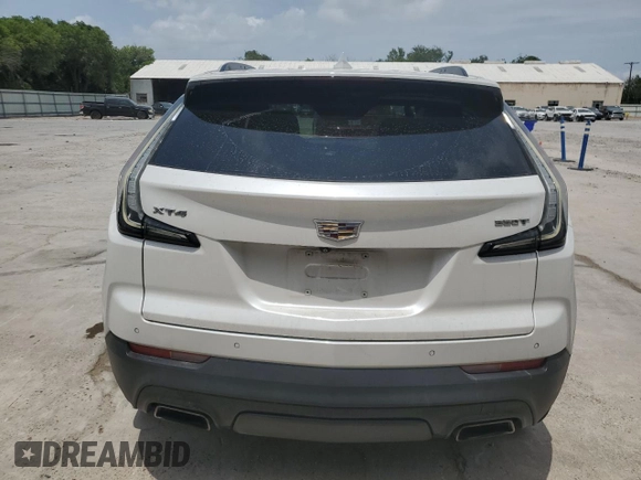 2020 Cadillac XT4 FWD Sport with VIN 1GYFZER49LF123830, listed as a Copart auction lot 55737985 with 98,871 mi miles and Salvage title. Bid and sale history available at DreamBid. Image 6.