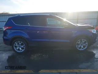 2014 Ford Escape Titanium with VIN 1FMCU9JX4EUD30964, listed as a IAAI auction lot 41772153 with 179,481 mi miles and . Bid and sale history available at DreamBid. Image 13.