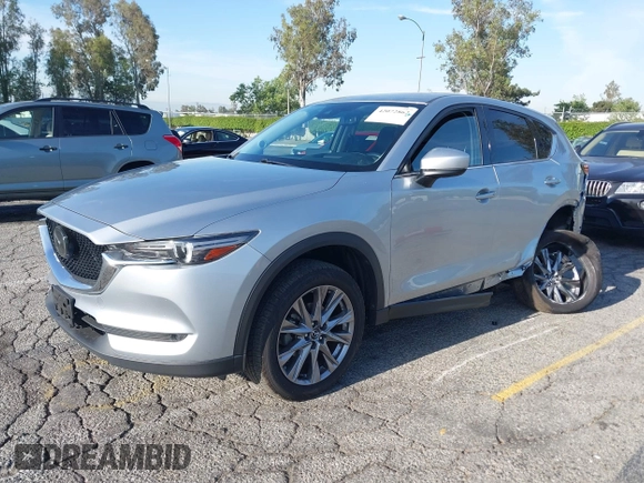 2021 Mazda CX-5 Grand Touring with VIN JM3KFADM1M1393251, listed as a IAAI auction lot 42072862 with 47,758 mi miles. Bid and sale history available at carsss.com. Image 19.