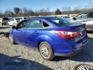 2014 Ford Focus Titanium with VIN 1FADP3J27EL410059, listed as a Copart auction lot 41634085 with 156,053 mi miles and Salvage Title. Bid and sale history available at carsss.com. Image 2.