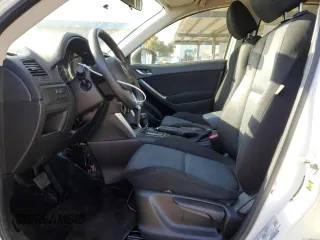 2013 Mazda CX-5 Sport with VIN JM3KE2BE7D0148951, listed as a Copart auction lot 57782115 with 65,677 mi miles and Salvage title. Bid and sale history available at DreamBid. Image 7.