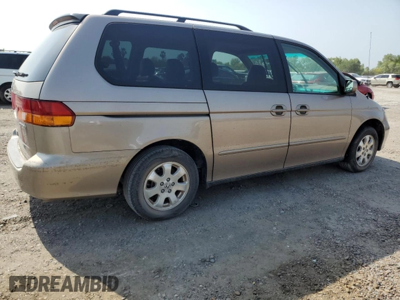 2004 Honda Odyssey EX-L with VIN 5FNRL18934B107378, listed as a Copart auction lot 51972795 with 186,043 mi miles and Salvage Title. Bid and sale history available at DreamBid. Image 3.