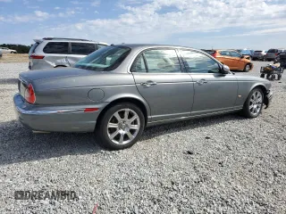 2006 Jaguar XJ with VIN SAJWA71B06SH03941, listed as a Copart auction lot 76013984 with 0 mi miles and Salvage Title. Bid and sale history available at carsss.com. Image 3.