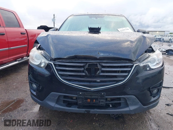 2016 Mazda CX-5 Grand Touring z VIN JM3KE4DY9G0605489, wystawiony jako IAAI lot #42085160 z przebiegiem 160 338 mil mil oraz . Historia ofert i sprzedaży dostępna na DreamBid. Obrazek 12.