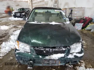 1999 Mazda Protege DX z VIN JM1BJ2220X0108600, wystawiony jako Copart lot #77004894 z przebiegiem 220 836 mil mil oraz Szkoda całkowita • Salvage title. Historia ofert i sprzedaży dostępna na DreamBid. Obrazek 5.