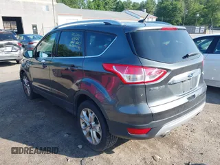 2016 Ford Escape Titanium with VIN 1FMCU9J99GUB27573, listed as a IAAI auction lot 42445457 with 156,784 mi miles and . Bid and sale history available at DreamBid. Image 3.