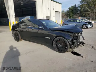 2011 BMW 7 Series 740Li with VIN WBAKB4C54BC574973, listed as a Copart auction lot 82299024 with 0 mi miles and Salvage Title. Bid and sale history available at carsss.com. Image 4.