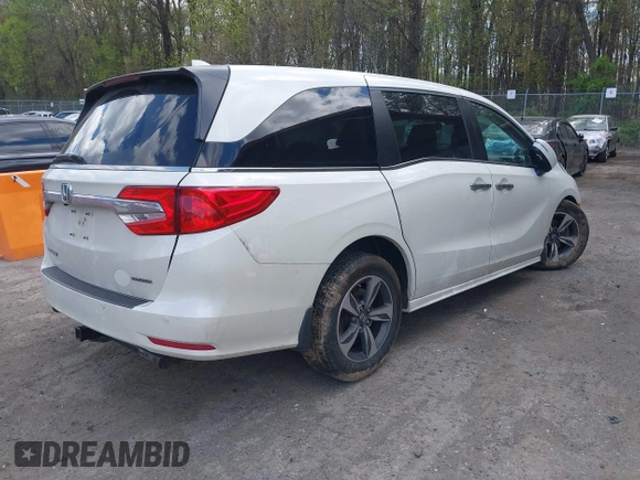 2018 Honda Odyssey Touring with VIN 5FNRL6H81JB023530, listed as a IAAI auction lot 42040124 with 109,128 mi miles and . Bid and sale history available at DreamBid. Image 4.