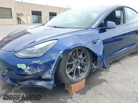 2021 Tesla Model 3 Long Range with VIN 5YJ3E1EB6MF878411, listed as a IAAI auction lot 41986947 with 71,978 mi miles and . Bid and sale history available at DreamBid. Image 6.
