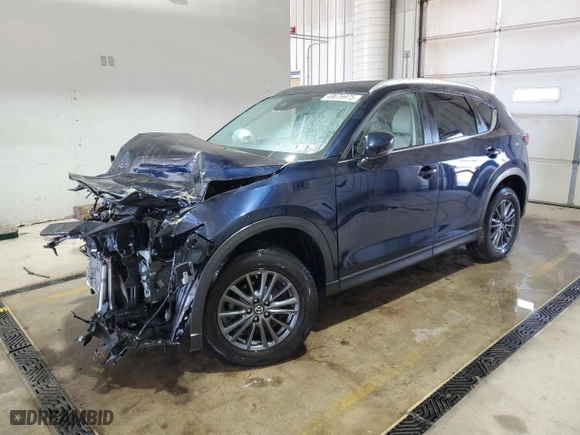 2019 Mazda CX-5 Touring with VIN JM3KFBCM1K0587787, listed as a Copart auction lot 49676975 with NaN miles and Salvage Title. Bid and sale history available at carsss.com. Image 1.