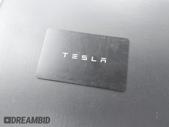 2018 Tesla Model 3 Long Range Battery with VIN 5YJ3E1EB4JF086012, listed as a IAAI auction lot 41683859 with 52,059 mi miles and . Bid and sale history available at DreamBid. Image 11.