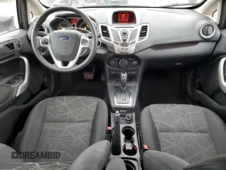 2012 Ford Fiesta SE z VIN 3FADP4BJ8CM152416, wystawiony jako Copart lot #57753335 z przebiegiem 25 293 mil mil oraz Szkody całkowita. Historia ofert i sprzedaży dostępna na DreamBid. Obrazek 8.