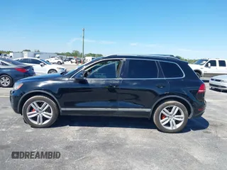 2013 Volkswagen Touareg Lux with VIN WVGEF9BP6DD004454, listed as a IAAI auction lot 41862958 with 239,548 mi miles and . Bid and sale history available at DreamBid. Image 14.