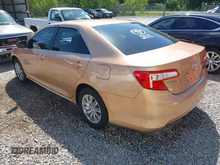 2012 Toyota Camry L with VIN 4T1BF1FKXCU030959, listed as a IAAI auction lot 42022501 with 304,524 mi miles. Bid and sale history available at carsss.com. Image 3.