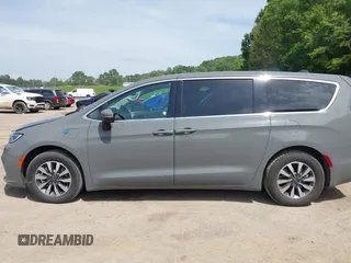 2023 Chrysler Pacifica Hybrid Touring L with VIN 2C4RC1L73PR522988, listed as a IAAI auction lot 42280263 with 54,939 mi miles and . Bid and sale history available at DreamBid. Image 14.