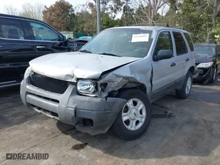 2004 Ford Escape XLT with VIN 1FMYU03184KB74819, listed as a IAAI auction lot 41838482 with 223,651 mi miles. Bid and sale history available at carsss.com. Image 2.