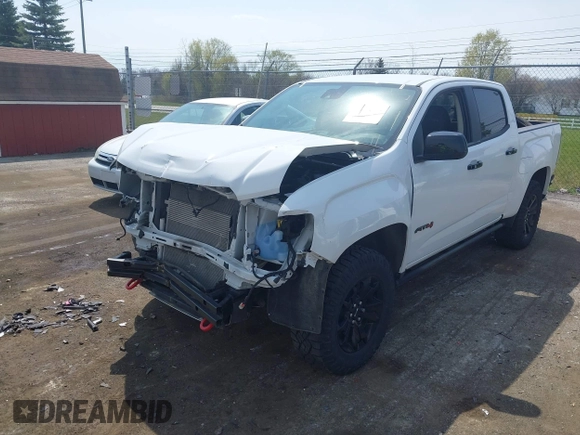 2021 GMC Canyon 4WD AT4 z VIN 1GTG6FENXM1291689, wystawiony jako IAAI lot #42038884 z przebiegiem 54 884 mil mil oraz . Historia ofert i sprzedaży dostępna na DreamBid. Obrazek 2.