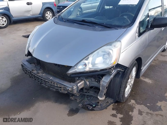 2009 Honda Fit Sport w/Navi with VIN JHMGE88629S018457, listed as a IAAI auction lot 41431959 with 165,213 mi miles. Bid and sale history available at carsss.com. Image 6.