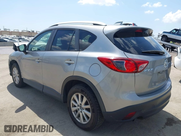 2014 Mazda CX-5 Touring z VIN JM3KE2CYXE0322943, wystawiony jako IAAI lot #41934670 z przebiegiem 110 690 mil mil oraz . Historia ofert i sprzedaży dostępna na DreamBid. Obrazek 3.