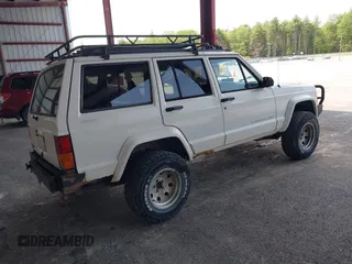 1996 Jeep Cherokee Sport with VIN 1J4FJ68S5TL259449, listed as a IAAI auction lot 42376697 with 72,835 mi miles and . Bid and sale history available at DreamBid. Image 4.