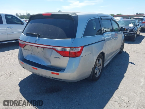 2012 Honda Odyssey Touring with VIN 5FNRL5H90CB099519, listed as a IAAI auction lot 41854550 with 185,110 mi miles. Bid and sale history available at carsss.com. Image 4.