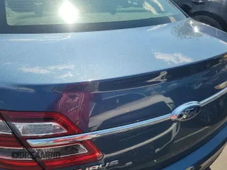 2018 Ford Taurus SEL with VIN 1FAHP2E89JG139146, listed as a IAAI auction lot 42152990 with 104,023 mi miles. Bid and sale history available at carsss.com. Image 1.