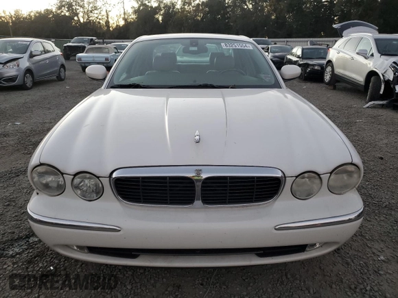 2004 Jaguar XJ with VIN SAJWA71C14SG16264, listed as a Copart auction lot 83251554 with 267,493 mi miles and Salvage Title. Bid and sale history available at carsss.com. Image 5.