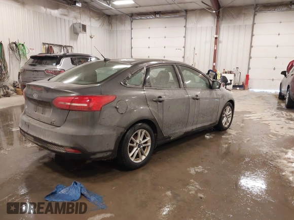 2015 Ford Focus SE with VIN 1FADP3F2XFL342480, listed as a IAAI auction lot 41607487 with 103,530 mi miles. Bid and sale history available at carsss.com. Image 4.