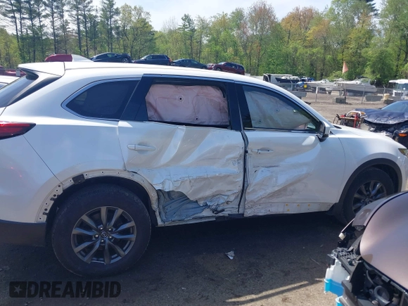 2021 Mazda CX-9 Touring z VIN JM3TCBCYXM0521323, wystawiony jako IAAI lot #42190976 z przebiegiem 56 652 mil mil oraz . Historia ofert i sprzedaży dostępna na DreamBid. Obrazek 13.