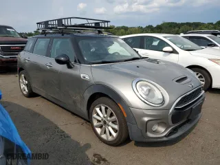 2017 MINI Clubman Cooper S with VIN WMWLU5C55H2F24329, listed as a Copart auction lot 67163314 with 129,818 mi miles and Salvage Title. Bid and sale history available at carsss.com. Image 4.