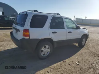 2004 Ford Escape XLT with VIN 1FMYU93104KA32047, listed as a Copart auction lot 61364985 with 160,822 mi miles and Salvage title. Bid and sale history available at DreamBid. Image 3.
