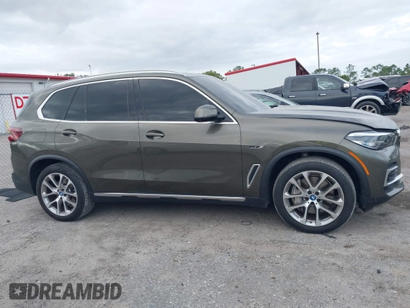 2022 BMW X5 xDrive45e z VIN 5UXTA6C00N9L06383, wystawiony jako IAAI lot #38552162 z przebiegiem 19 592 mil mil oraz . Historia ofert i sprzedaży dostępna na DreamBid. Obrazek 13.
