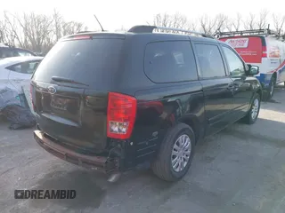 2011 Kia Sedona LX with VIN KNDMG4C70B6411556, listed as a IAAI auction lot 41768777 with 124,180 mi miles. Bid and sale history available at carsss.com. Image 4.