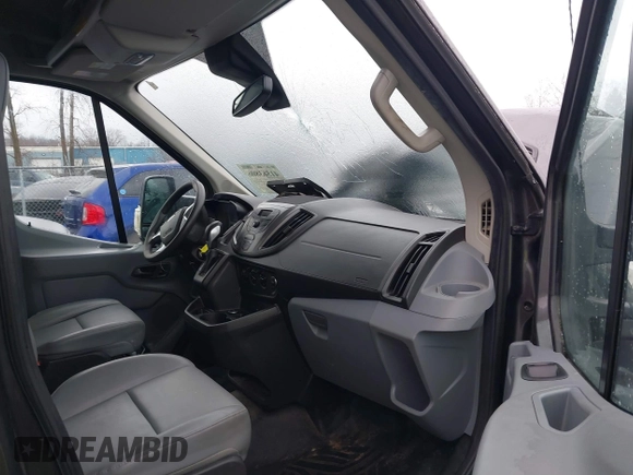 2016 Ford Transit Cargo z VIN 1FTYR2CG8GKB14176, wystawiony jako IAAI lot #41563806 z przebiegiem 93 177 mil mil oraz . Historia ofert i sprzedaży dostępna na DreamBid. Obrazek 5.
