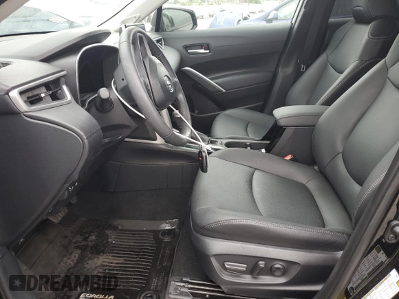 2024 Toyota Corolla Cross XLE with VIN 7MUDAAAG8RV095021, listed as a Copart auction lot 59232265 with 7,010 mi miles and Salvage title. Bid and sale history available at DreamBid. Image 7.