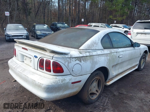 1997 Ford Mustang with VIN 1FALP4040VF200826, listed as a IAAI auction lot 41555969 with 82,134 mi miles. Bid and sale history available at carsss.com. Image 4.
