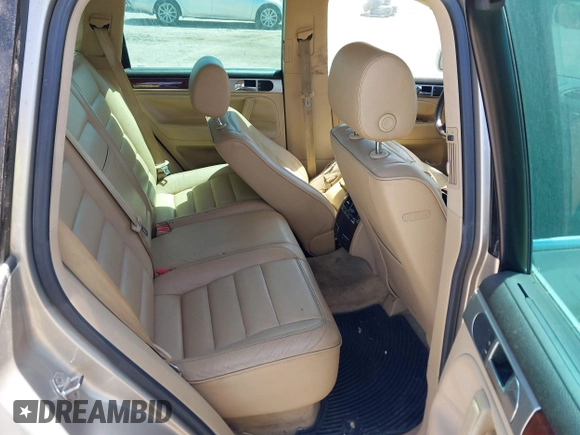 2004 Volkswagen Touareg with VIN WVGCM67L44D033856, listed as a IAAI auction lot 42142143 with 105,682 mi miles and . Bid and sale history available at DreamBid. Image 8.